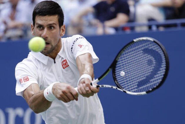 Novak Djokovic, of Serbia, returns a shot to Gael Monfils, of France, during the semifinals of the U.S. Open tennis tournament, Friday, Sept. 9, 2016, in New York. (AP Photo/Julio Cortez)