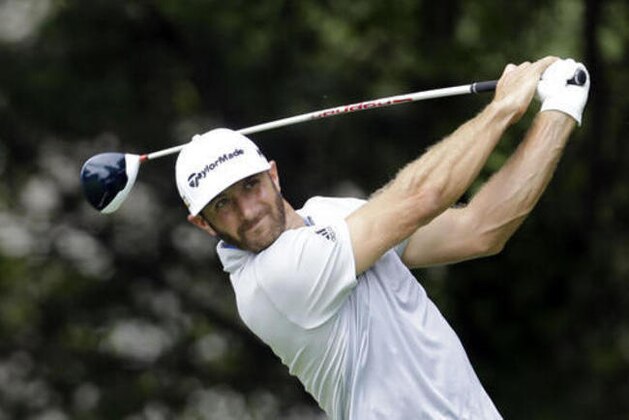 Dustin Johnson watches his drive off the tee on the fifth hole during the second round of the BMW Championship golf tournament at Crooked Stick Golf Club in Carmel, Ind., Friday, Sept. 9, 2016. (AP Photo/AJ Mast)