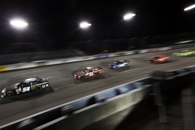 Kurt Busch leads the pack during the NASCAR Xfinity auto race at Richmond International Raceway in Richmond, Va., Friday, Sept. 11, 2015. (AP Photo/Chet Strange)