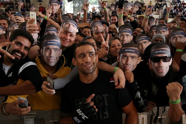 RIO DE JANEIRO, BRAZIL - MAY 11: Heavyweight champion Fabricio Werdum of Brazil takes photos with fans during an open training session at Arena da Baixada stadium on May 11, 2016 in Curitiba, Brazil. (Photo by Buda Mendes/Zuffa LLC/Zuffa LLC via Getty Images)