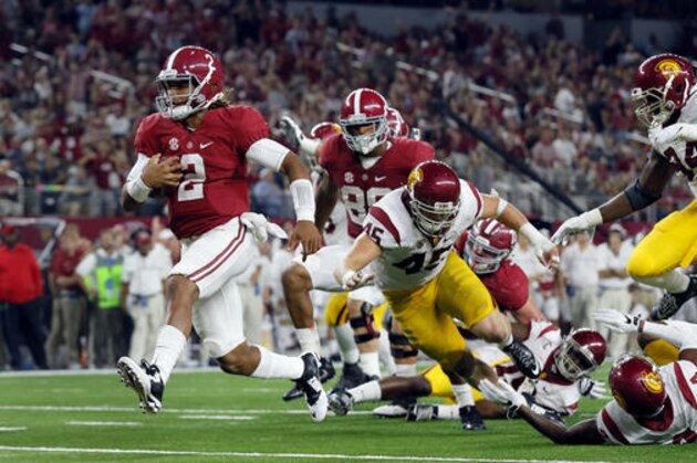 Alabama quarterback Jalen Hurts slips into the end zone on a 7-yard touchdown run during the second half of an NCAA college football game against Southern California on Saturday, Sept. 3, 2016, in Arlington, Texas. (AP Photo/Tony Gutierrez)