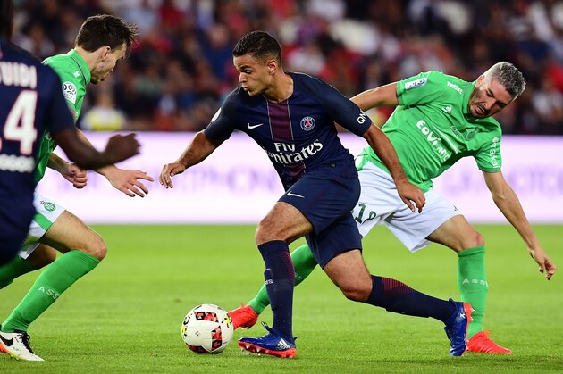 Paris Saint-Germain's French forward Hatem Ben Arfa (C) vies with Saint-Etienne's French defender Loic Perrin during the French L1 football match between Paris Saint-Germain and Saint-Etienne at the Parc des Princes stadium in Paris on September 9, 2016. / AFP / FRANCK FIFE        (Photo credit should read FRANCK FIFE/AFP/Getty Images)