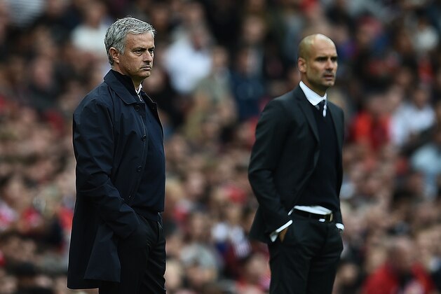 Manchester United's Portuguese manager Jose Mourinho (L) and Manchester City's Spanish manager Pep Guardiola watch from the touchline during the English Premier League football match between Manchester United and Manchester City at Old Trafford in Manchester, north west England, on September 10, 2016. / AFP / Oli SCARFF / RESTRICTED TO EDITORIAL USE. No use with unauthorized audio, video, data, fixture lists, club/league logos or 'live' services. Online in-match use limited to 75 images, no video emulation. No use in betting, games or single club/league/player publications.  /         (Photo credit should read OLI SCARFF/AFP/Getty Images)