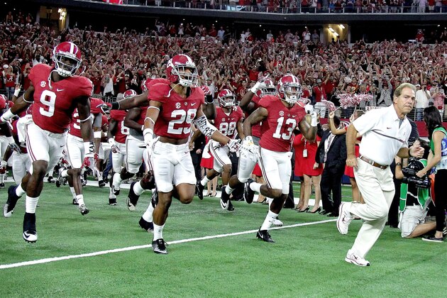 ARLINGTON, TX - SEPTEMBER 03:  Head coach Nick Saban of the Alabama Crimson Tide takes his team to the field against the USC Trojan during the AdvoCare Classic at AT