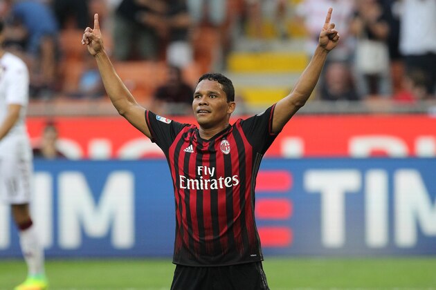 MILAN, ITALY - AUGUST 21:  Carlos Bacca of AC Milan celebrates his second goal during the Serie A match between AC Milan and FC Torino at Stadio Giuseppe Meazza on August 21, 2016 in Milan, Italy.  (Photo by Marco Luzzani/Getty Images)