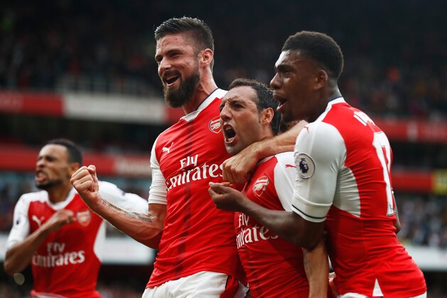 LONDON, ENGLAND - SEPTEMBER 10:  Santi Cazorla of Arsenal celebrates scoring his sides second goal with his team mates during the Premier League match between Arsenal and Southampton at Emirates Stadium on September 10, 2016 in London, England.  (Photo by Clive Rose/Getty Images)