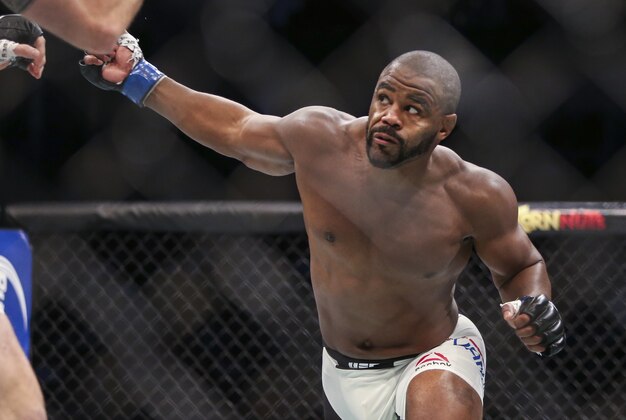 Oct 3, 2015; Houston, TX, USA; Rashad Evans (blue gloves) competes against Ryan Bader (red gloves) during their Light Heavyweight bout at UFC 192 at Toyota Center. Mandatory Credit: Troy Taormina-USA TODAY Sports