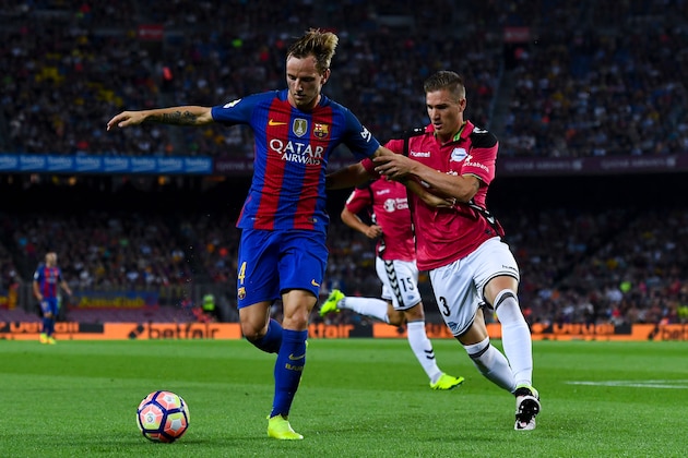 BARCELONA, SPAIN - SEPTEMBER 10:  Ivan Rakitic of FC Barcelona competes for the ball with Raul Garcia of Deportivo Alaves during the La Liga match between FC Barcelona and Deportivo Alaves at Camp Nou stadium on September 10, 2016 in Barcelona, Spain.  (Photo by David Ramos/Getty Images)