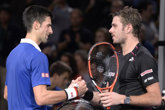 Serbia's Novak Djokovic (L) shakes hands with Switzerland's Stan Wawrinka after winning their semi-final tennis match at the ATP World Tour Masters 1000 indoor tennis tournament in Paris on November 7, 2015. AFP PHOTO / MIGUEL MEDINA        (Photo credit should read MIGUEL MEDINA/AFP/Getty Images)