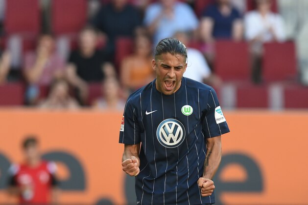 Wolfsburg's Swiss defender Ricardo Rodriguez celebrates after his goal for Wolfsburg during the German first division Bundesliga football match of FC Augsburg vs VfL Wolfsburg in Augsburg, southern Germany, on August 27, 2016.  / AFP / CHRISTOF STACHE / RESTRICTIONS: DURING MATCH TIME: DFL RULES TO LIMIT THE ONLINE USAGE TO 15 PICTURES PER MATCH AND FORBID IMAGE SEQUENCES TO SIMULATE VIDEO. == RESTRICTED TO EDITORIAL USE == FOR FURTHER QUERIES PLEASE CONTACT DFL DIRECTLY AT + 49 69 650050
        (Photo credit should read CHRISTOF STACHE/AFP/Getty Images)