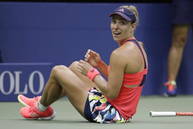 Angelique Kerber, of Germany, looks back at her box after winning the women's singles final against Karolina Pliskova, of the Czech Republic, at the U.S. Open tennis tournament, Saturday, Sept. 10, 2016, in New York. (AP Photo/Julio Cortez)