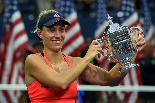 Angelique Kerber of Germany poses with her winning trophy after defeating Karolina Pliskova of Czech Republic in their 2016 US Open Womens Singles final match at the USTA Billie Jean King National Tennis Center in New York on September 10, 2016.
New world number one Angelique Kerber won the US Open title on Saturday with a battling 6-3, 4-6, 6-4 victory over Karolina Pliskova of the Czech Republic. / AFP / Timothy A. CLARY        (Photo credit should read TIMOTHY A. CLARY/AFP/Getty Images)