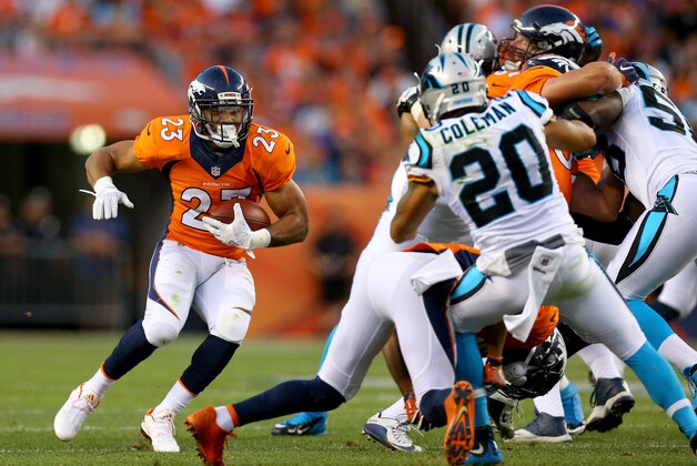 DENVER, CO - SEPTEMBER 08:  Running back Devontae Booker #23 of the Denver Broncos runs the ball against free safety Kurt Coleman #20 of the Carolina Panthers in the first half at Sports Authority Field at Mile High on September 8, 2016 in Denver, Colorado.  (Photo by Justin Edmonds/Getty Images)