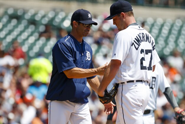 Aug 4, 2016; Detroit, MI, USA; Detroit Tigers manager Brad Ausmus (7) takes the ball to relieve starting pitcher Jordan Zimmermann (27) in the second inning against the Chicago White Sox at Comerica Park. Mandatory Credit: Rick Osentoski-USA TODAY Sports