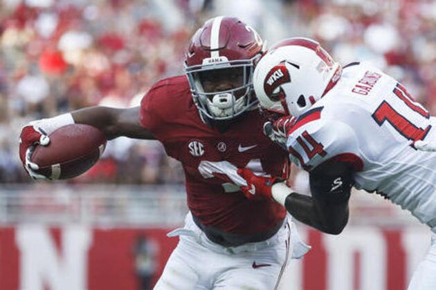Western Kentucky defensive back Juwan Gardner tackles Alabama running back B.J. Emmons during the second half of an NCAA college football game against Western Kentucky, Saturday, Sept. 10, 2016, in Tuscaloosa, Ala. Alabama won 38-10. (AP Photo/Brynn Anderson)