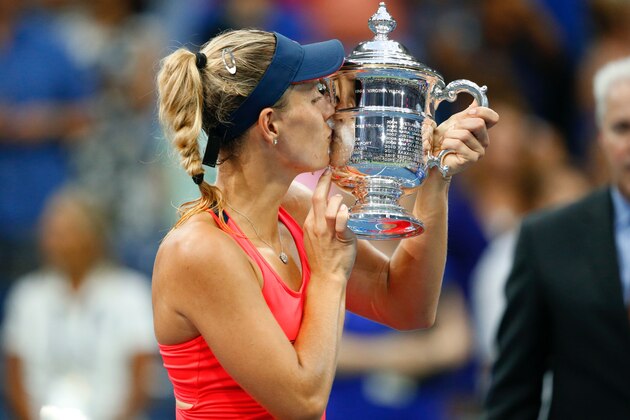 Angelique Kerber of Germany poses with her winning trophy after defeating Karolina Pliskova of Czech Republic in their 2016 US Open Womens Singles final match at the USTA Billie Jean King National Tennis Center in New York on September 10, 2016.
New world number one Angelique Kerber won the US Open title on Saturday with a battling 6-3, 4-6, 6-4 victory over Karolina Pliskova of the Czech Republic. / AFP / Kena Betancur        (Photo credit should read KENA BETANCUR/AFP/Getty Images)