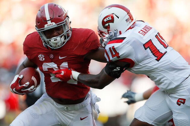 TUSCALOOSA, AL - SEPTEMBER 10:  B.J. Emmons #21 of the Alabama Crimson Tide stiff arms Juwan Gardner #14 of the Western Kentucky Hilltoppers at Bryant-Denny Stadium on September 10, 2016 in Tuscaloosa, Alabama.  (Photo by Kevin C. Cox/Getty Images)