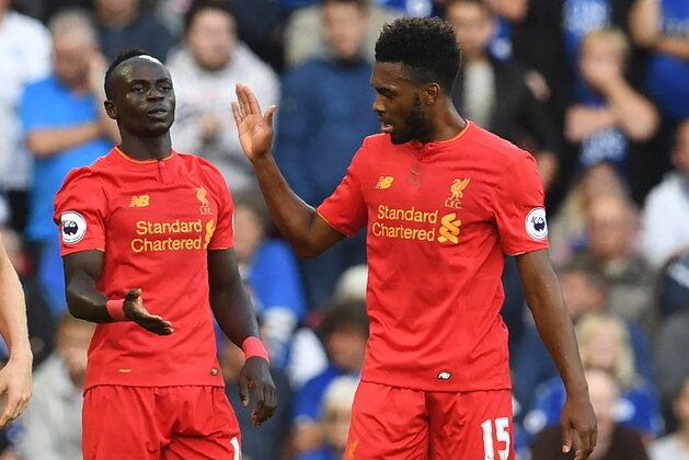 Liverpool's Senegalese midfielder Sadio Mane celebrates with Liverpool's English striker Daniel Sturridge (R) after scoring their second goal during the English Premier League football match between Liverpool and Leicester City at Anfield in Liverpool, north west England on September 10, 2016. / AFP / Paul ELLIS / RESTRICTED TO EDITORIAL USE. No use with unauthorized audio, video, data, fixture lists, club/league logos or 'live' services. Online in-match use limited to 75 images, no video emulation. No use in betting, games or single club/league/player publications.  /         (Photo credit should read PAUL ELLIS/AFP/Getty Images)
