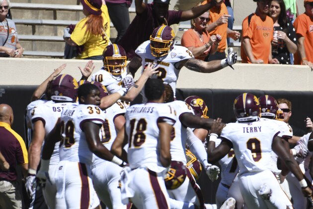 STILL WATER, OK - SEPTEMBER 10: Quarterback Cooper Rush #10 of the Central Michigan Chippewas and tight end Tyler Conklin #83 of the Central Michigan Chippewas celebrate after a NCAA football game, September 10, 2016 at Boone Pickens Stadium in Stillwater, Oklahoma. Central Michigan won 30-27 on the last play of the game.  (Photo by J Pat Carter/Getty Images)