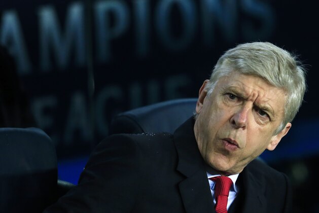 Arsenal's French coach Arsene Wenger gestures no his bench before the UEFA Champions League Round of 16 second leg football match FC Barcelona vs Arsenal FC at the Camp Nou stadium in Barcelona on March 16, 2016.  / AFP / PAU BARRENA        (Photo credit should read PAU BARRENA/AFP/Getty Images)