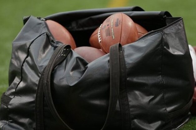 A bag a footballs sits on the sidelines during the first half of an NFL football game between the Minnesota Vikings and the Tennessee Titans Sunday, Oct. 7, 2012, in Minneapolis. (AP Photo/Charlie Neibergall)