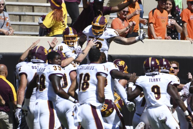 STILL WATER, OK - SEPTEMBER 10: Quarterback Cooper Rush #10 of the Central Michigan Chippewas and tight end Tyler Conklin #83 of the Central Michigan Chippewas celebrate after a NCAA football game, September 10, 2016 at Boone Pickens Stadium in Stillwater, Oklahoma. Central Michigan won 30-27 on the last play of the game.  (Photo by J Pat Carter/Getty Images)