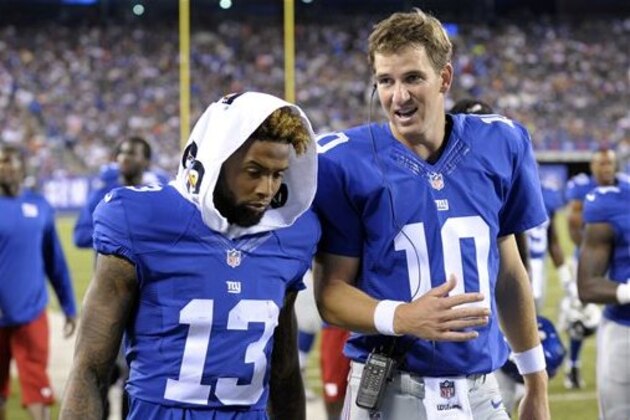 FILE - In this Aug. 22, 2015, file photo, New York Giants quarterback Eli Manning (10) and Odell Beckham (13) talk while walking off the field after the first half of a preseason NFL football game in East Rutherford, N.J. Sunday’s game at co-owned and co-shared MetLife Stadium is about the prize that has eluded these teams for years. It’s about making the playoffs .  The Jets (6-5) and Giants (5-6) enter December with legitimate chances to make the playoffs. (AP Photo/Bill Kostroun, File0