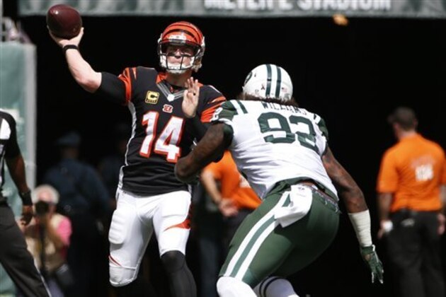Cincinnati Bengals quarterback Andy Dalton (14) throws a pass  as New York Jets' Leonard Williams (92) rushes him during the first half of an NFL football game Sunday, Sept. 11, 2016 in East Rutherford, N.J.  (AP Photo/Kathy Willens)