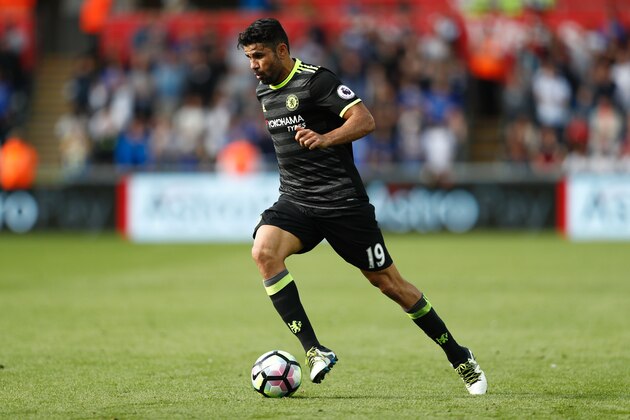 Chelsea's Brazilian-born Spanish striker Diego Costa runs with the ball during the English Premier League football match between Swansea City and Chelsea at The Liberty Stadium in Swansea, south Wales on September 11, 2016. / AFP / Adrian DENNIS / RESTRICTED TO EDITORIAL USE. No use with unauthorized audio, video, data, fixture lists, club/league logos or 'live' services. Online in-match use limited to 75 images, no video emulation. No use in betting, games or single club/league/player publications.  /         (Photo credit should read ADRIAN DENNIS/AFP/Getty Images)