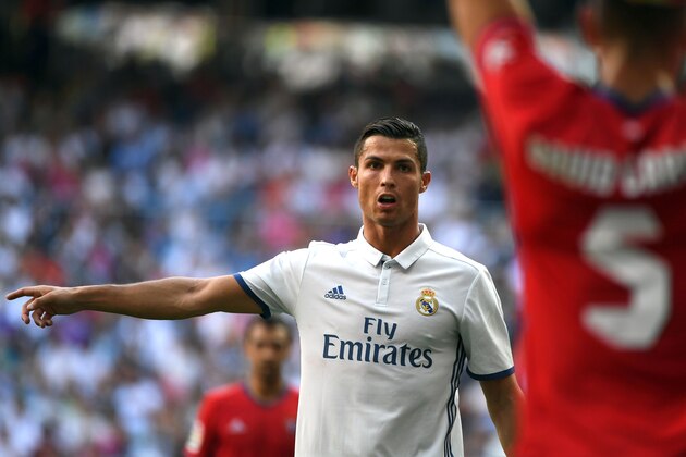 Real Madrid's Portuguese forward Cristiano Ronaldo gestures during the Spanish league football match Real Madrid CF vs CA Osasuna at the Santiago Bernabeu stadium in Madrid on September 10, 2016. / AFP / GERARD JULIEN        (Photo credit should read GERARD JULIEN/AFP/Getty Images)
