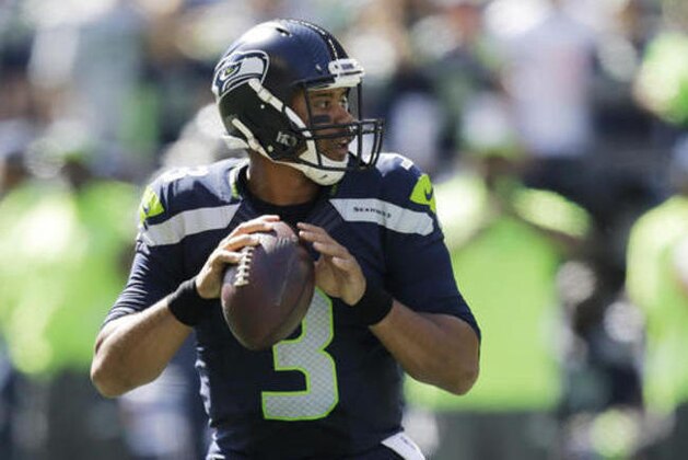 Seattle Seahawks quarterback Russell Wilson passes against the Miami Dolphins in the first half of an NFL football game, Sunday, Sept. 11, 2016, in Seattle. (AP Photo/Stephen Brashear)