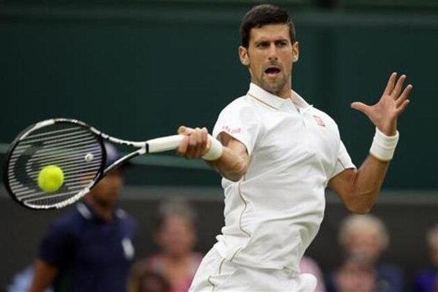 Novak Djokovic of Serbia returns to Adrian Mannarino of France during their men's singles match on day three of the Wimbledon Tennis Championships in London, Wednesday, June 29, 2016. (AP Photo/Tim Ireland)