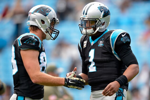 CHARLOTTE, NC - NOVEMBER 16:  Cam Newton #1 and Greg Olsen #88 of the Carolina Panthers shake hands before their game against the Atlanta Falcons at Bank of America Stadium on November 16, 2014 in Charlotte, North Carolina.  (Photo by Grant Halverson/Getty Images)