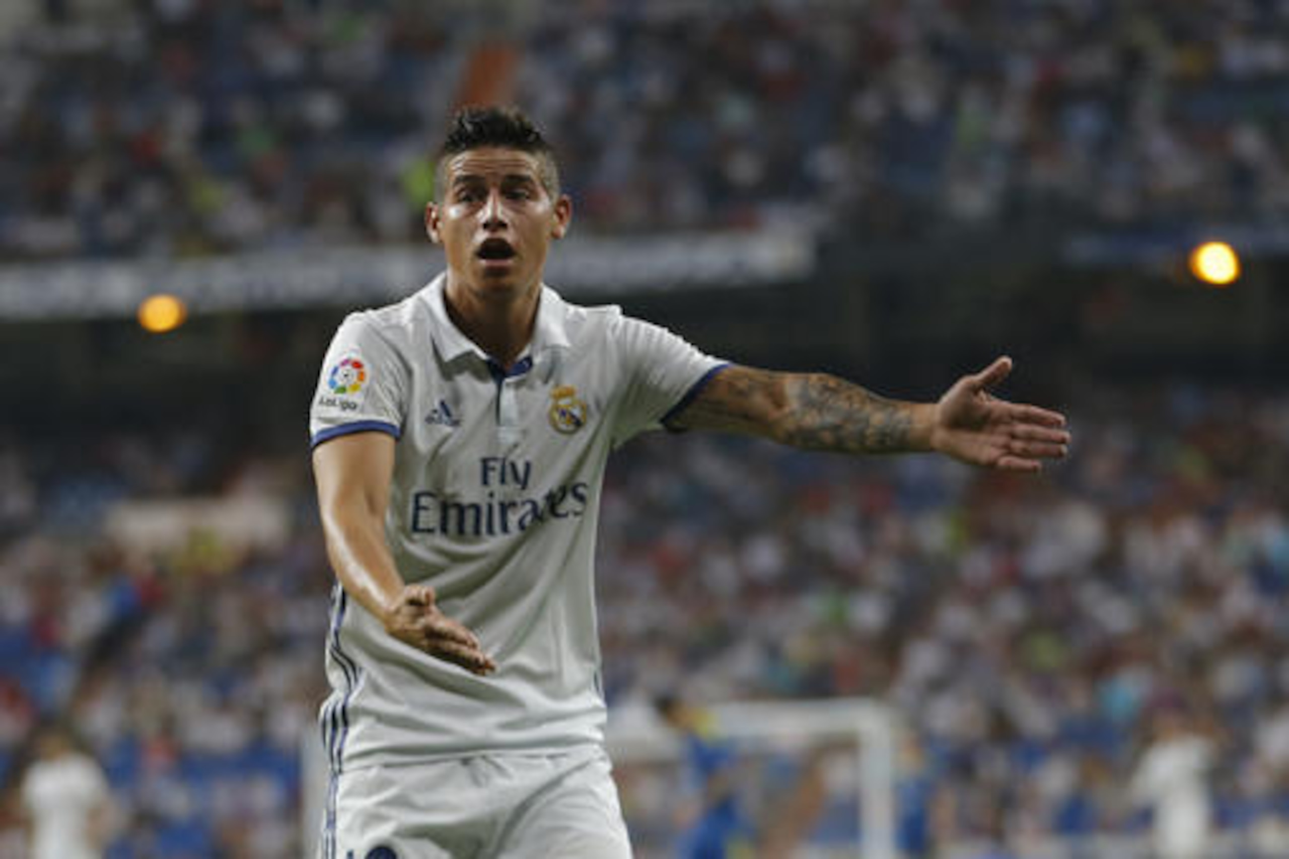 Real Madrid's James Rodriguez gestures to an assistant referee during the Spanish La Liga soccer match between Real Madrid and Celta Vigo at the Santiago Bernabeu stadium in Madrid, Saturday, Aug. 27, 2016. Real Madrid won 2-1. (AP Photo/Francisco Seco)