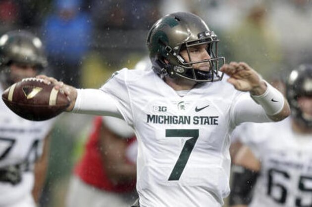 FILE - In this Nov. 21, 2015, file photo, Michigan State quarterback Tyler O'Connor throws a pass against Ohio State during the second quarter of an NCAA college football game, in Columbus, Ohio.Michigan State coach Mark Dantonio says fifth-year senior Tyler O’Connor is the team’s “headline guy” at quarterback as the Spartans try to move on without star Connor Cook. Dantonio spoke Monday, Aug. 8, 2016, at Michigan State’s media day. (AP Photo/Jay LaPrete, File)