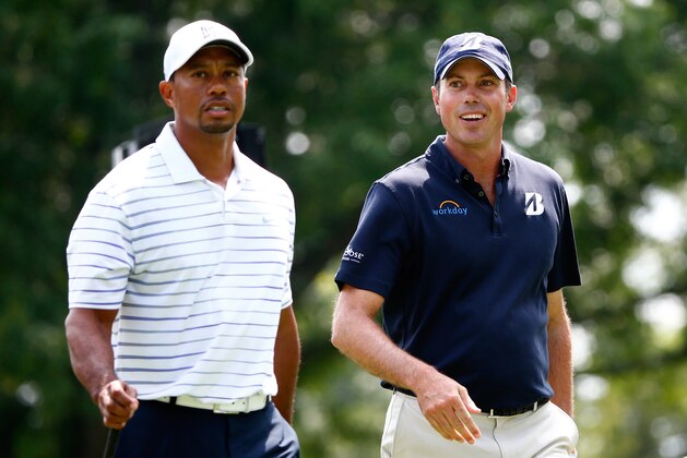 AKRON, OH - JULY 30:  Tiger Woods (L) and Matt Kuchar walk down the third hole during a practice round for the World Golf Championships-Bridgestone Invitational at Firestone Country Club South Course on July 30, 2014 in Akron, Ohio.  (Photo by Sam Greenwood/Getty Images)