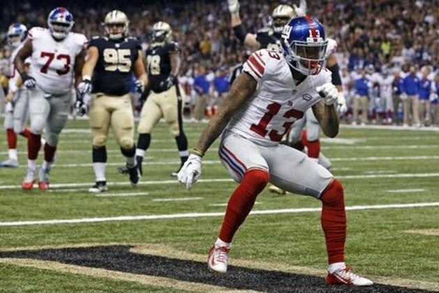 FILE - In this Nov. 1, 2015, file photo, New York Giants wide receiver Odell Beckham (13) celebrates his touchdown reception during an NFL football game against the New Orleans Saints in New Orleans. The Giants face the Philadelphia Eagles on Sunday, Jan. 3. (AP Photo/Jonathan Bachman, File)