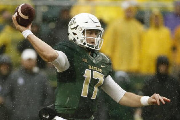 FILE - In this Oct. 24, 2015, file photo, Baylor's Seth Russell throws a pass in the first half of an NCAA college football game against Iowa State in Waco, Texas. If Russell stays healthy and can repeat what he was doing before getting hurt, the Bears could be near the top of the Big 12 standings.  (AP Photo/Tony Gutierrez, File)
