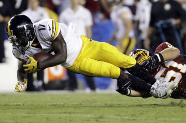 Pittsburgh Steelers wide receiver Eli Rogers (17) is pulled down by Washington Redskins inside linebacker Will Compton (51) during the first half of an NFL football game in Landover, Md., Monday, Sept. 12, 2016. (AP Photo/Patrick Semansky)