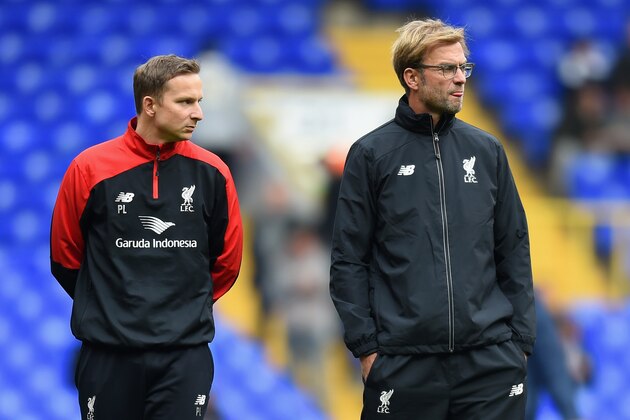 LONDON, ENGLAND - OCTOBER 17:  Jurgen Klopp (R), manager of Liverpool and First-team development coach Pepijn Lijnders (L) look on during the warm-up prior to the Barclays Premier League match between Tottenham Hotspur and Liverpool at White Hart Lane on October 17, 2015 in London, England.  (Photo by Michael Regan/Getty Images)