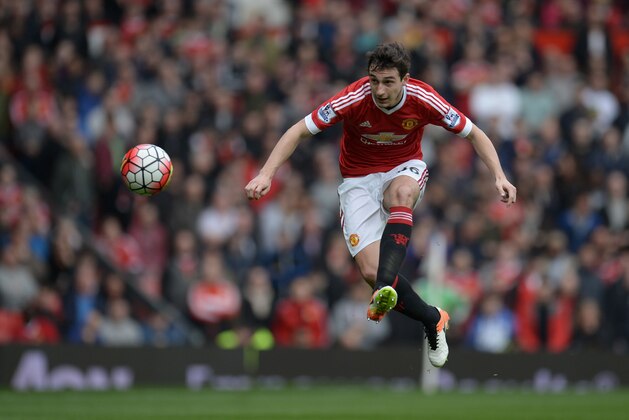 Manchester United's Italian defender Matteo Darmian plays the ball forward during the English Premier League football match between Manchester United and Everton at Old Trafford in Manchester, north west England, on April 3, 2016. / AFP / OLI SCARFF / RESTRICTED TO EDITORIAL USE. No use with unauthorized audio, video, data, fixture lists, club/league logos or 'live' services. Online in-match use limited to 75 images, no video emulation. No use in betting, games or single club/league/player publications.  /         (Photo credit should read OLI SCARFF/AFP/Getty Images)