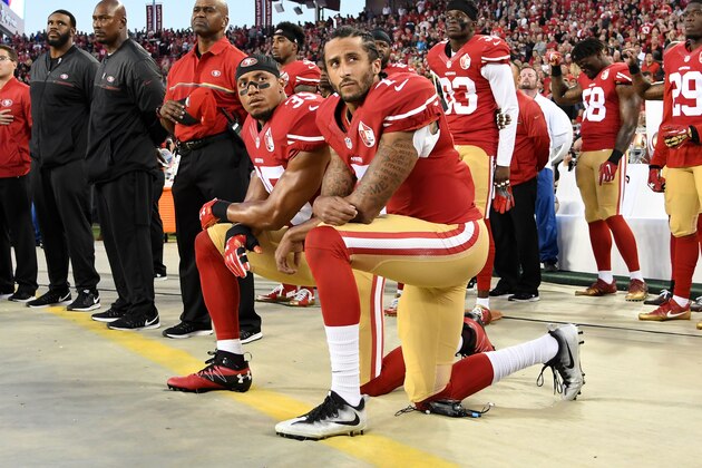SANTA CLARA, CA - SEPTEMBER 12:  Colin Kaepernick #7 and Eric Reid #35 of the San Francisco 49ers kneel in protest during the national anthem prior to playing the Los Angeles Rams in their NFL game at Levi's Stadium on September 12, 2016 in Santa Clara, California.  (Photo by Thearon W. Henderson/Getty Images)