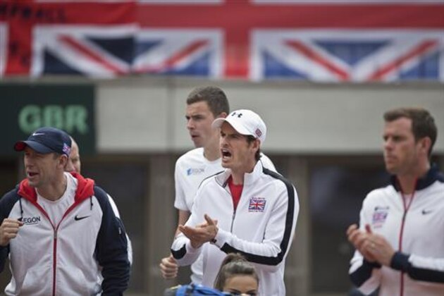Britain's Andy Murray, center, shows support for the British Davis Cup team during their Davis Cup quarterfinal tennis match against Serbia in Belgrade, Serbia, Saturday, July 16, 2016. (AP Photo/Marko Drobnjakovic)