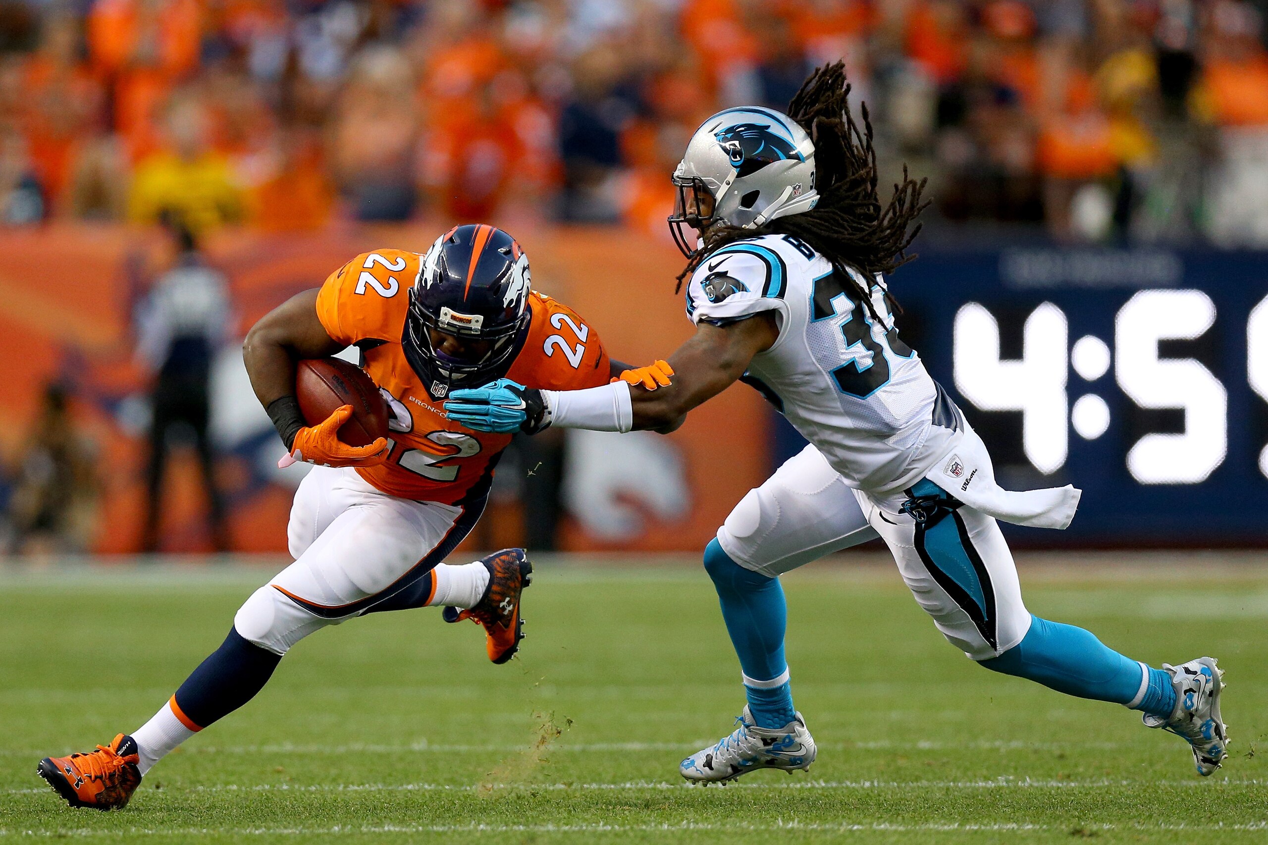 DENVER, CO - SEPTEMBER 08:  Running back C.J. Anderson #22 of the Denver Broncos runs the ball against free safety Tre Boston #33 of the Carolina Panthers in the first half at Sports Authority Field at Mile High on September 8, 2016 in Denver, Colorado.  (Photo by Justin Edmonds/Getty Images)