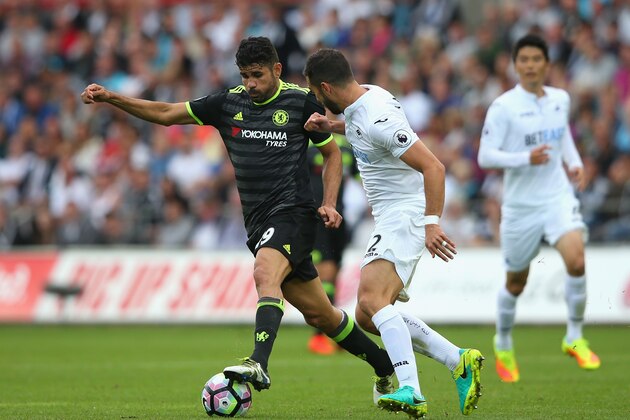 SWANSEA, WALES - SEPTEMBER 11:  Jordi Amat of Swansea City battles with Diego Costa of Chelsea during the Premier League match between Swansea City and Chelsea at Liberty Stadium on September 11, 2016 in Swansea, Wales.  (Photo by Alex Livesey/Getty Images)