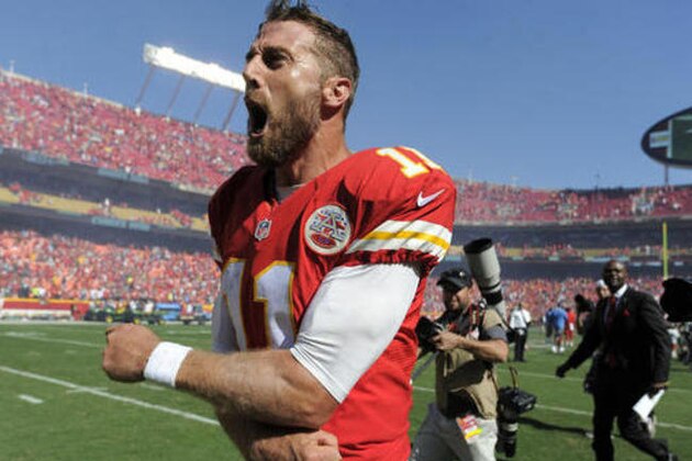 Kansas City Chiefs quarterback Alex Smith (11) celebrates after he scored the winning touchdown against the San Diego Chargers in overtime in an NFL football game in Kansas City, Mo., Sunday, Sept. 11, 2016. The Kansas City Chiefs won 33-27. (AP Photo/Ed Zurga)