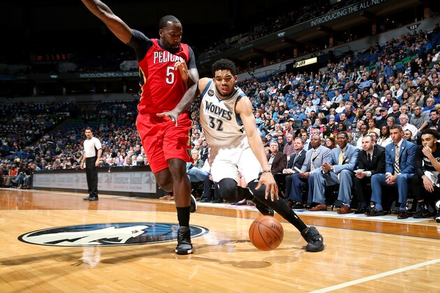 MINNEAPOLIS, MN -  APRIL 13: Karl-Anthony Towns #32 of the Minnesota Timberwolves drives to the basket during the game against the New Orleans Pelicans on April 13, 2016 at Target Center in Minneapolis, Minnesota. NOTE TO USER: User expressly acknowledges and agrees that, by downloading and or using this Photograph, user is consenting to the terms and conditions of the Getty Images License Agreement. Mandatory Copyright Notice: Copyright 2016 NBAE (Photo by David Sherman/NBAE via Getty Images)