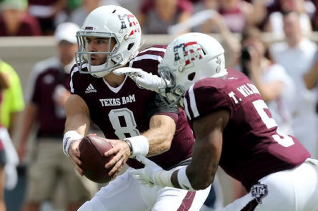 Texas A&M quarterback Trevor Knight (8) fakes a hand off to teammate Trayveon Williams (5) during an NCAA college football game against Prairie View A&M, Saturday, Sept. 10, 2016, in College Station, Texas. (AP Photo/Sam Craft)