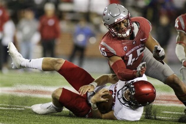 Washington State linebacker Logan Tago (45) brings down Eastern Washington quarterback Gage Gubrud during the second half of an NCAA college football game in Pullman, Wash., Saturday, Sept. 3, 2016. (AP Photo/Young Kwak)