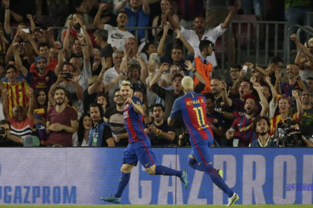 Barcelona's Lionel Messi, left, celebrates with Barcelona's Neymar after scoring the opening goal during a Champions League, Group C soccer match between Barcelona and Celtic, at the Camp Nou stadium in Barcelona, Spain, Tuesday, Sept. 13, 2016. (AP Photo/Emilio Morenatti)